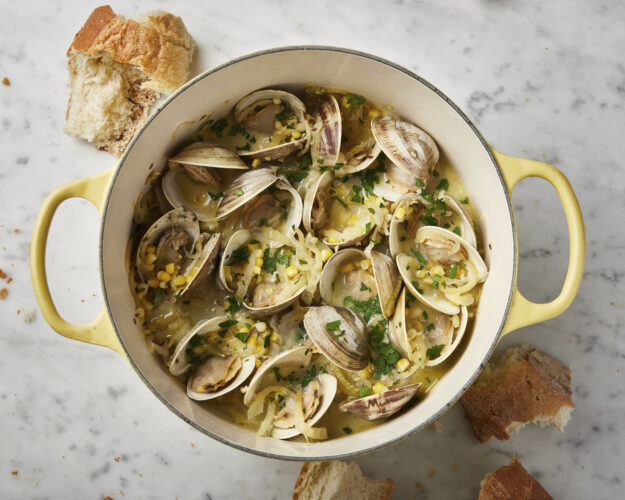 Crème fraîche creates a creamy broth in this recipe for briny-sweet steamed clams
